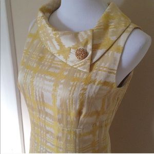 Vintage inspired sheath dress with jeweled brooch